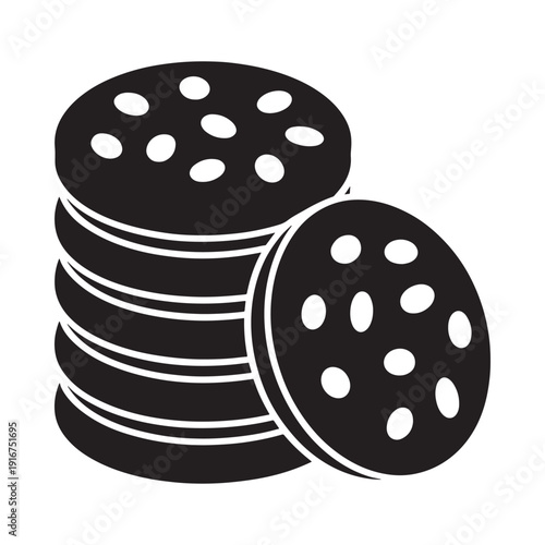 A stack of chocolate cookies with one leaning beside it