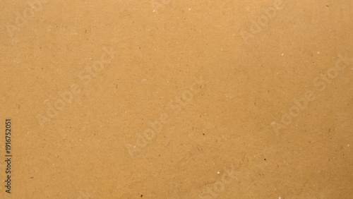 Abstract pattern of beige rough carton, old paper sheet, parchment or papyrus surface. Background of brown kraft paper or cardboard texture. 