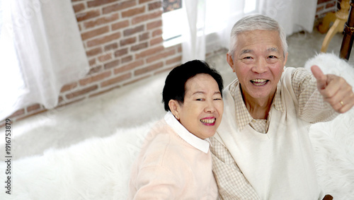 Fotografi Asian older senior couple in rich wealthy house interior together