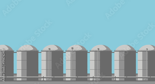 Row of Gray Recycling Bins Against a Blue Sky.