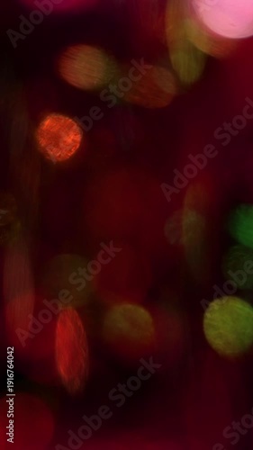 Dynamic Vertical Bokeh Transition with vibrant red and pink hues, perfect for energetic backgrounds.