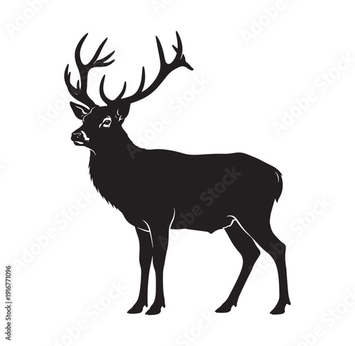 black silhouette of a deer with large antlers standing alone