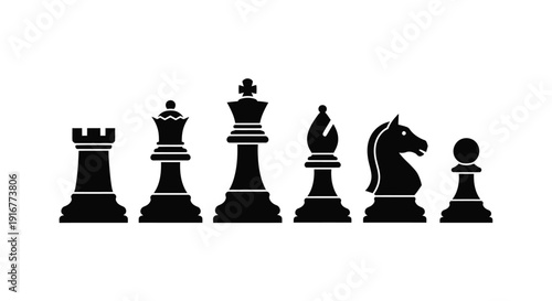 Black chess pieces arranged in a line stark silhouette
