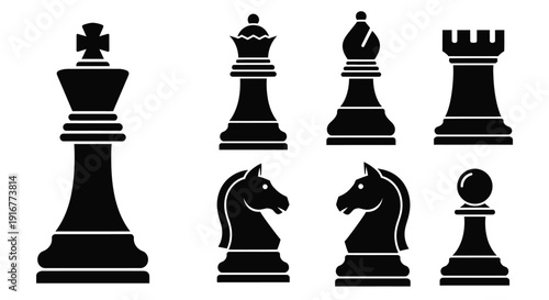 Black chess pieces arranged in a row stark silhouette