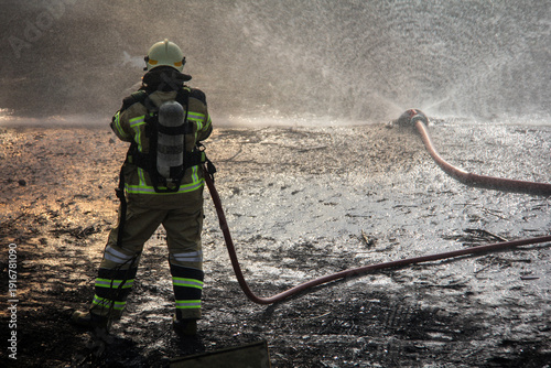 Wallpaper Mural Fire fighting and extinguishing operations with diffuser and water hose Torontodigital.ca