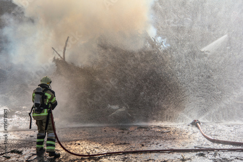 Wallpaper Mural Fire fighting and extinguishing operations with diffuser and water hose Torontodigital.ca