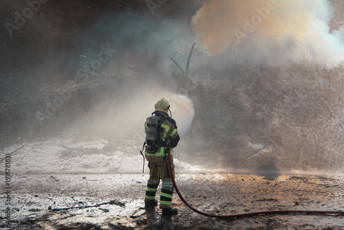 Wallpaper Mural Fire fighting and extinguishing operations with diffuser and water hose Torontodigital.ca