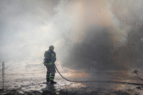 Wallpaper Mural Fire fighting and extinguishing operations with diffuser and water hose Torontodigital.ca