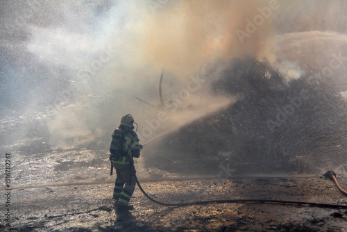 Wallpaper Mural Fire fighting and extinguishing operations with diffuser and water hose Torontodigital.ca