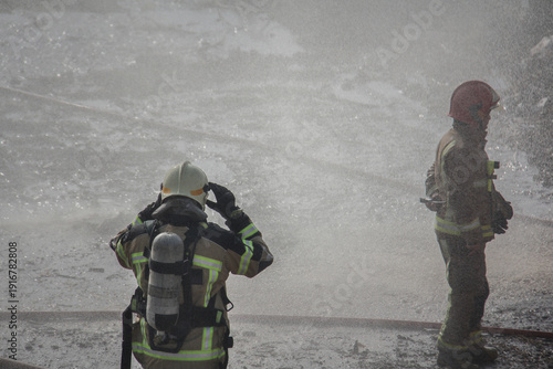Wallpaper Mural Fire fighting and extinguishing operations with diffuser and water hose Torontodigital.ca