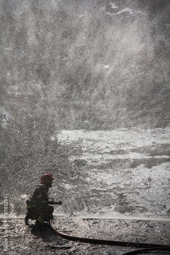Wallpaper Mural Fire fighting and extinguishing operations with diffuser and water hose Torontodigital.ca