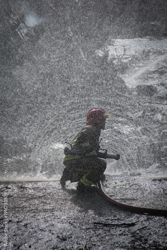 Wallpaper Mural Fire fighting and extinguishing operations with diffuser and water hose Torontodigital.ca