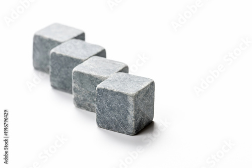Square stones lined up to cool whiskey.