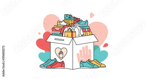Cardboard box filled with donated clothes and shoes represents charity, community support, and volunteering for people in need.