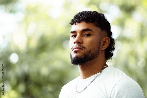 Young man with serious expression looking directly