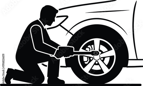 Silhouette Person changing car tire using jack and wrench on roadside