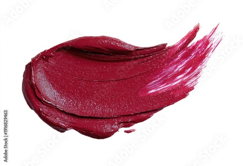 Swatch of richly pigmented red-purple makeup product, smeared diagonally on white background