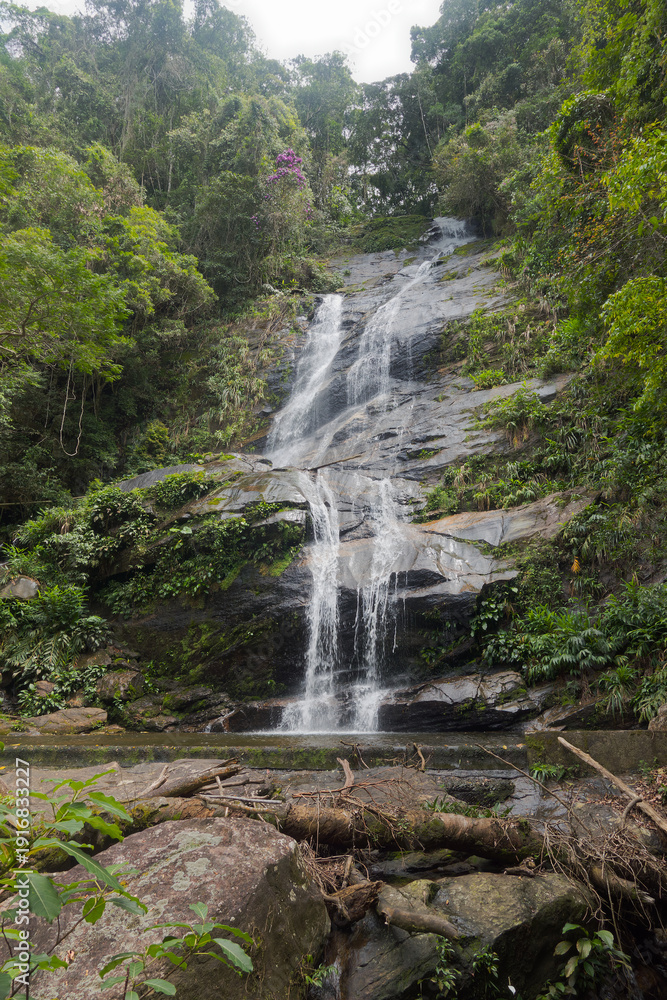 Obraz premium Idyllic scenery at Taunay Waterfall at Tijuca National Park at Brazilian city of Rio de Janeiro on a spring day. Photo taken October 13th, 2025, Rio de Janeiro, Brazil.