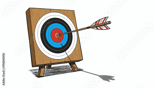 Archery target with arrow hitting the bullseye on a wooden stand.