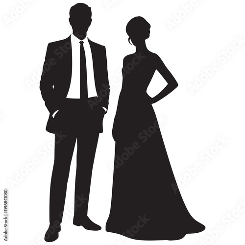 Silhouette image of man in suit and woman in long gown standing together