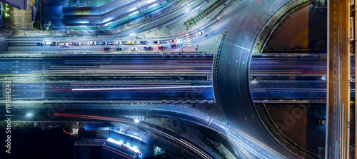 Expressway top view, Road traffic an important infrastructure, car traffic transportation above intersection road in city night, aerial view cityscape of advanced innovation, financial technology © Hand Robot
