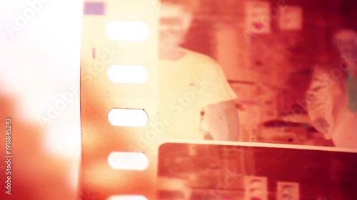 film burn transition with red and white light flares and streaks. Use this footage to add vintage effects and transitions to your videos.