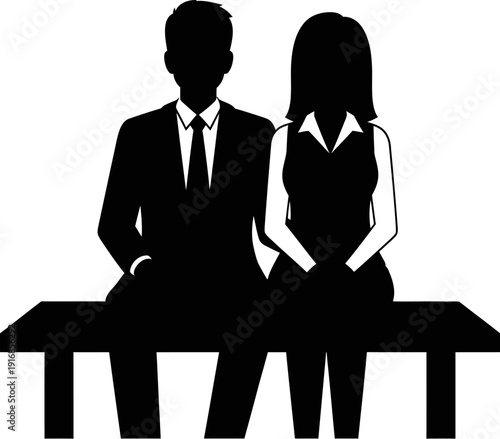 Silhouette of a man and woman sitting on a table in business attire together