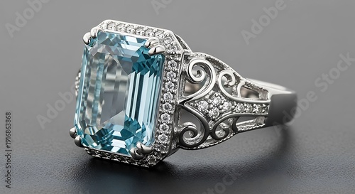 Elegant antique ring featuring a large aquamarine gemstone and intricate silver filigree design