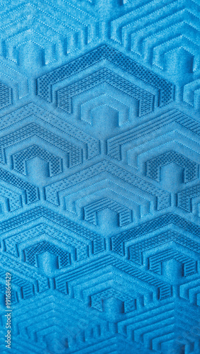 Sky Blue Jacquard Knit Fabric Texture with Raised 3D Geometric Pattern - 8K Ultra High-Resolution Vertical Wallpaper Background with Copy Space for Design.