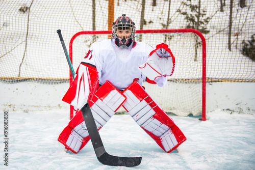 Canvas Print Ice hockey teen goaler outside in uniform