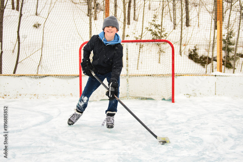 Photography Ice hockey teen play hockey outside in winter