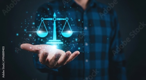 A person holding a glowing blue scale of justice in their hand
