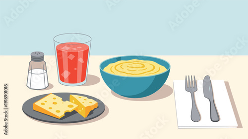Simple and healthy meal set featuring cheese slices, a glass of tomato juice, and a bowl of mashed food on a table.