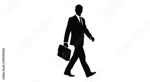 Silhouette of a determined businessman walking forward while firmly carrying a briefcase in hand