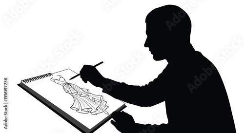 Silhouette of a fashion designer sketching an elegant flowing gown design onto a sketchbook pad