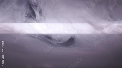 Dense white smoke billows around a horizontal beam of bright light in a dark violet studio environment. Concept of mystery, dramatic atmosphere, science fiction, and cinematic lighting effects.