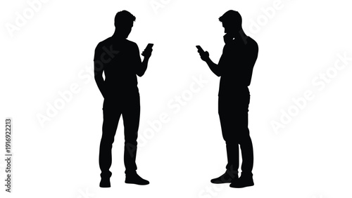Two men stand facing each other both intently focused on their mobile phones