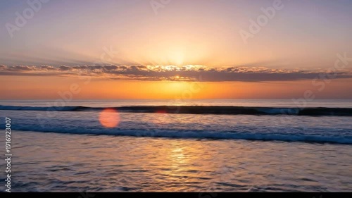 Beautiful Ocean Sunset with Gentle Waves and Colorful Sky.
