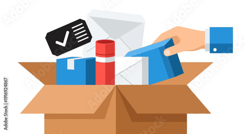 Hand packing items into an open cardboard box.