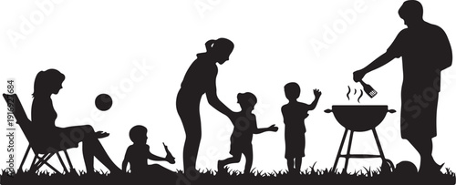 Family silhouettes barbecuing and playing in the yard