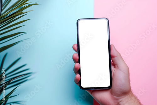hand of young man holding close-up mobile cell phone