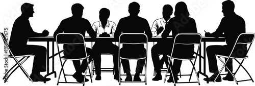 Silhouette of business people sitting at a long table during a corporate meeting or conference