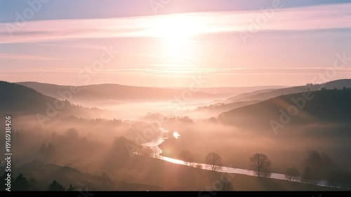 Breathtaking Sunrise Over Misty Valley with Winding River and Rolling Hills.