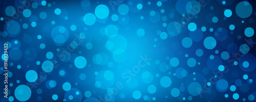 Shiny blue bokeh background with circles and flashes