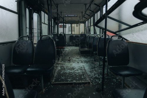 Quadro su tela Interior of a public bus destroyed by an explosion with shattered glass covering the floor