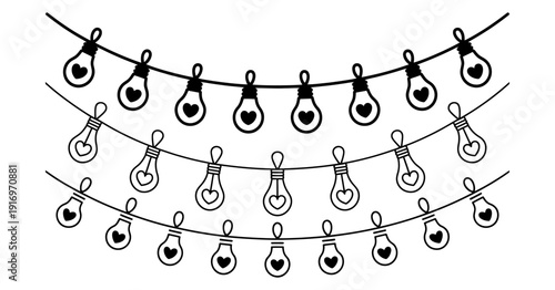 Three strands of black and white string lights with heart shaped bulbs are displayed