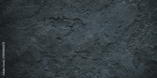 Tableau sur toile Dark textured slate wall with subtle variations in tone and a rough natural surf
