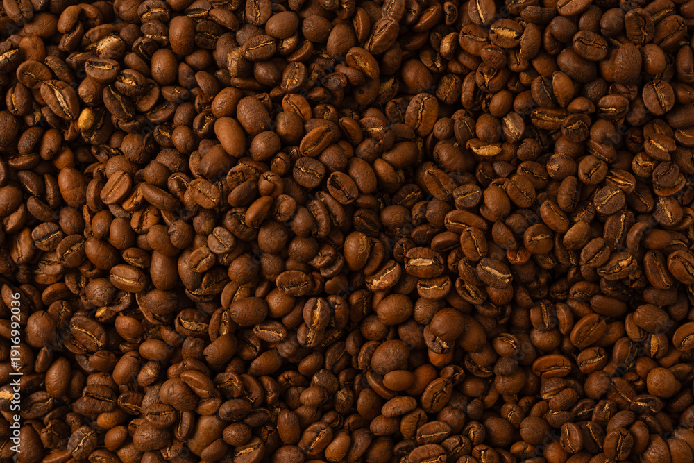 Fototapeta premium Coffee beans on a white background. Coffee beans texture.
