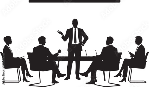 Five people in business meeting with one standing and speaking