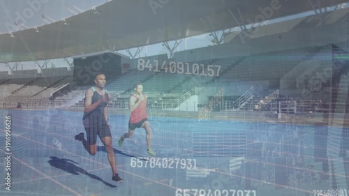 Animation of graphs and data processing over rugby player holding ball at sports stadium